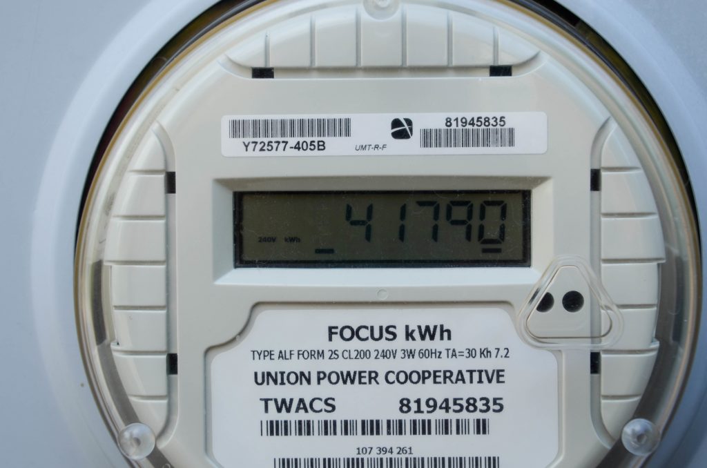 Utility meter showing kilowatt hours used in a month